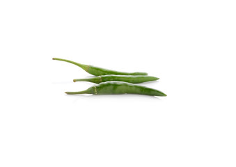 Obraz premium green hot chili peppers with stem on white background