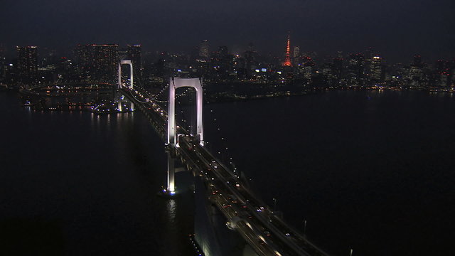 Aerial illuminated Metropolis city night Tokyo Bay Rainbow Bridge Odaiba Japan