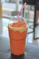 cold fruit juice on table.