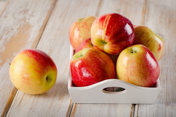 Fresh red  apples  on a wooden table