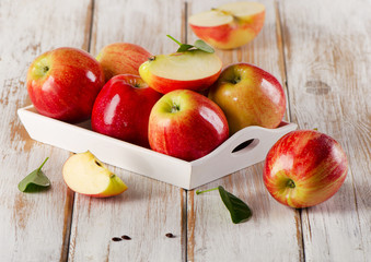 Fresh apples  in white box on a wooden table