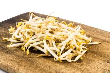 Pile of bean sprout on wooden chopping board