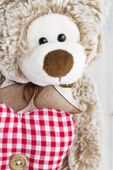 teddy bear holding heart