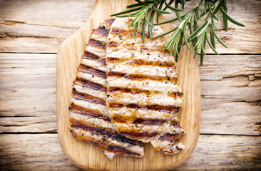 Grilled pork chops pieces. Spices and rosemary.