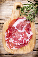 Dried pig meat slices. Delicatess.