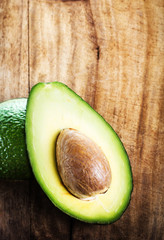 A sliced avocado on a cutting board