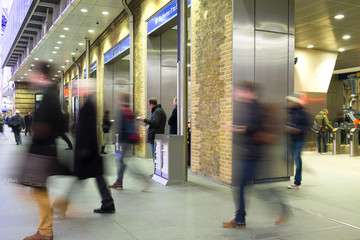 Fototapeta premium London Train Tube station Blur people movement in rush hour