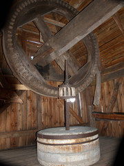 Interior and mechanism of an old wooden mill