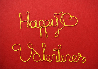 valentine's ribbon greeting and hearts on red background