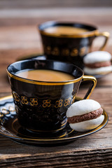 Nut-chocolate macaroons and coffee for dessert