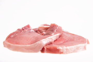 raw pork on a white background - copy space