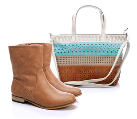 Brown women shoes and handbag on a white background