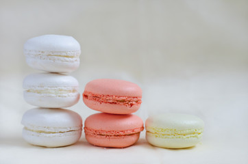 Fototapeta na wymiar Macarons colored in pastel colors standing columns