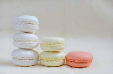 Macarons colored in pastel colors standing columns