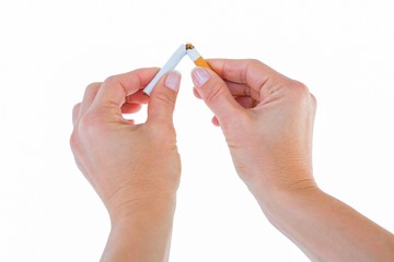 Close up of a woman breaking cigarette
