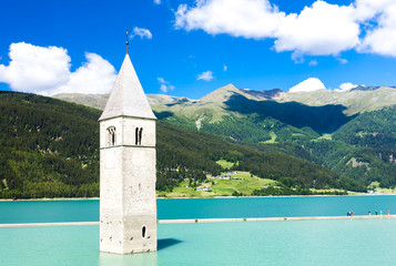 tower of sunken church in Resia lake, South Tyrol, Italy