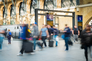 London Train Tube station Blur people movement in rush hour, at
