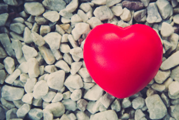 Obraz premium Red heart in love of Valentine's day with stone background.