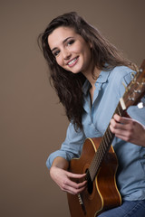 Beautiful girl playing guitar