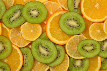 Orange, lemon and kiwi slices background