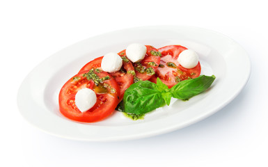Restaurant food isolated - tomatoes with mozzarella, basil and s