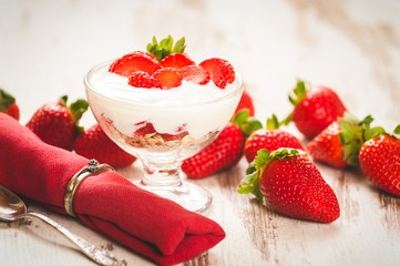 Fluffy and full of vitamins healthy strawberries on white wooden