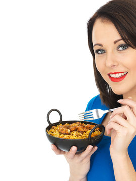 Young Woman Eating Chicken Tikka Biryani