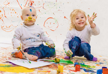 The boy and the girl draw