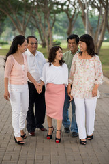 Aged people walking in the park