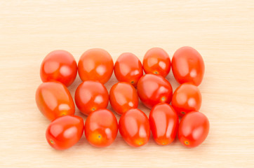 Fresh tomatoes on wooden background