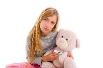 blond girl with teddy bear thermometer and flu