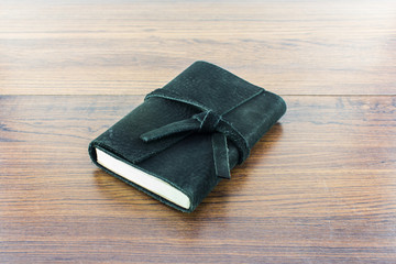 Leather notebooks on wood