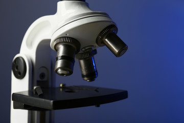 Fototapeta na wymiar Microscope on color background, close-up