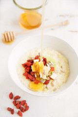 millet porridge with milk,goji berries, apple, honey and seeds