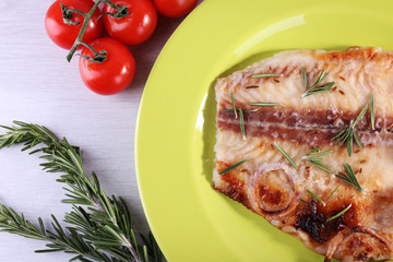 Dish of Pangasius fillet with rosemary and cherry tomatoes in