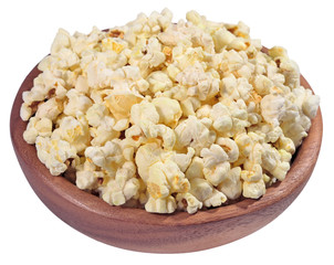 Fresh popcorn in a wooden bowl on a white