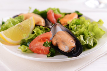 Tasty seafood on plate on table close-up