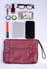 Ladies handbag and things with accessories of it isolated
