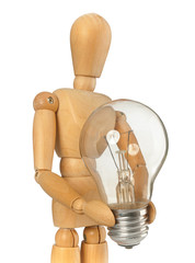 Wooden dummy that maintains a light bulb in hand