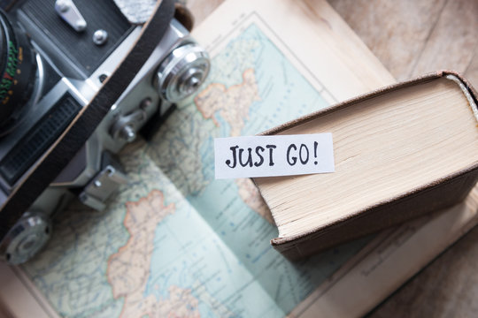 "Just go" book, map, camera