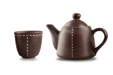 brown teapot and cup on the white backgroup