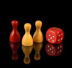 Yellow figures, red figures and playing dice on black background
