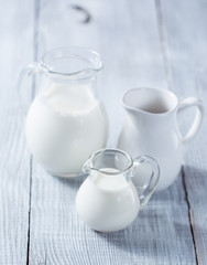 Obraz na płótnie Canvas Three milk jars