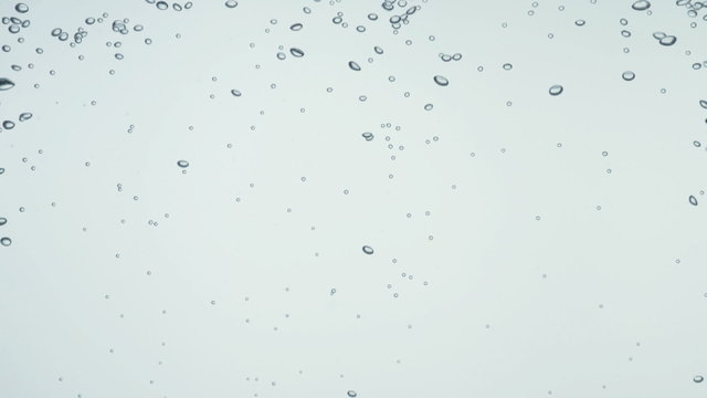 Water bubbles and action over white background