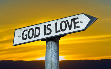 God is Love sign with a sunset background - obrazy, fototapety, plakaty