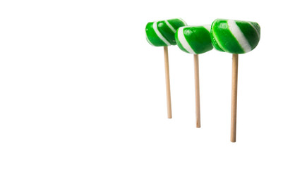 Green swirl peppermint candies over white background