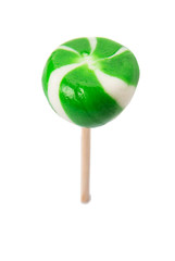 Green swirl peppermint candies over white background