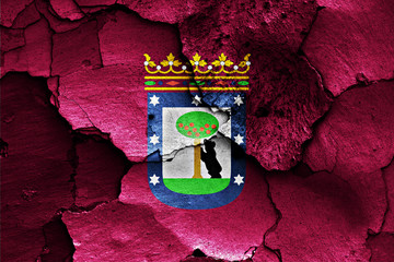 flag of Madrid painted on cracked wall