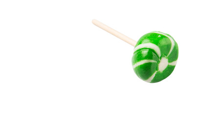 Green swirl peppermint candies over white background
