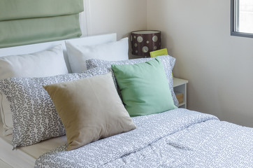 brown and green pillow on bed in kid's bedroom